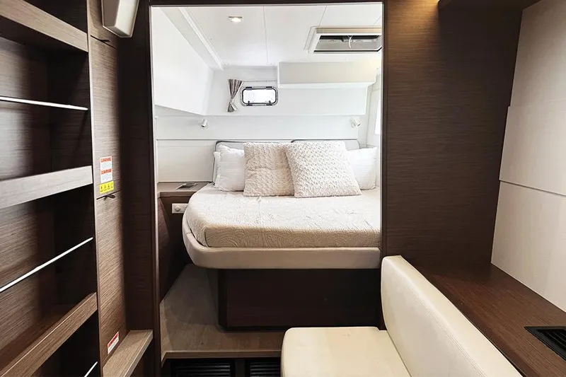Coquina Yacht Photos Pics Luxurious cabin interior of 2019 Lagoon 40 catamaran with cozy bed and modern design.