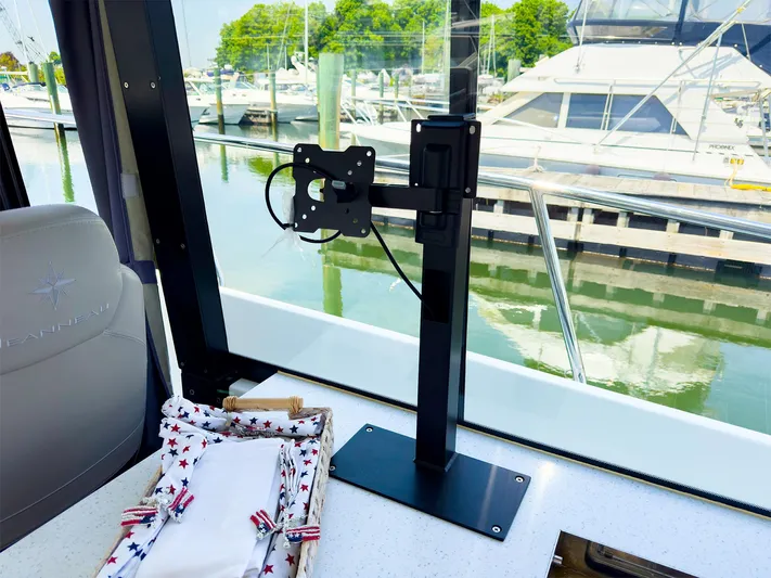 4761ak Yacht Photos Pics Interior view of 2021 Jeanneau NC 1095 FLY with marina background.