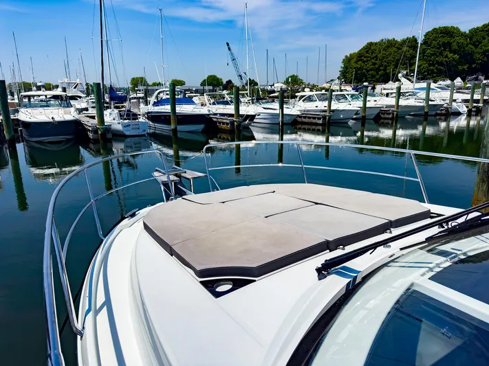 4761ak Yacht Photos Pics 2021 Jeanneau NC 1095 FLY at marina with other boats.