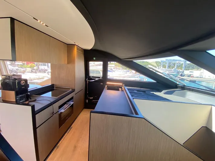  Yacht Photos Pics Luxurious interior of 2022 Ferretti Yachts 720, featuring modern kitchen and sleek design.