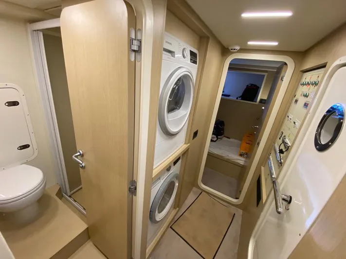  Yacht Photos Pics Laundry area and bathroom inside a 2022 Ferretti Yachts 720.
