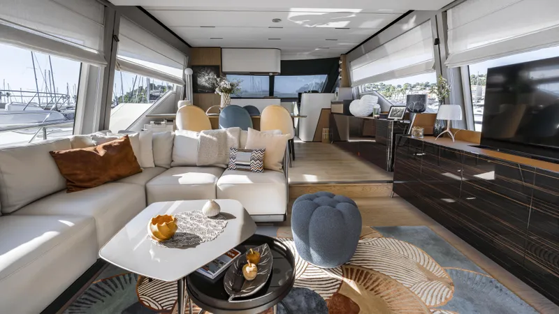  Yacht Photos Pics Luxurious interior of 2022 Ferretti Yachts 720 with modern furnishings and large windows.