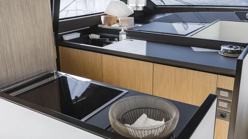  Yacht Photos Pics Modern kitchen interior on 2022 Ferretti Yachts 720, featuring sleek countertops and appliances.