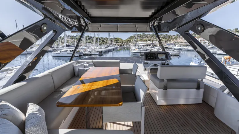  Yacht Photos Pics Luxurious 2022 Ferretti Yachts 720 interior with elegant seating and marina view.