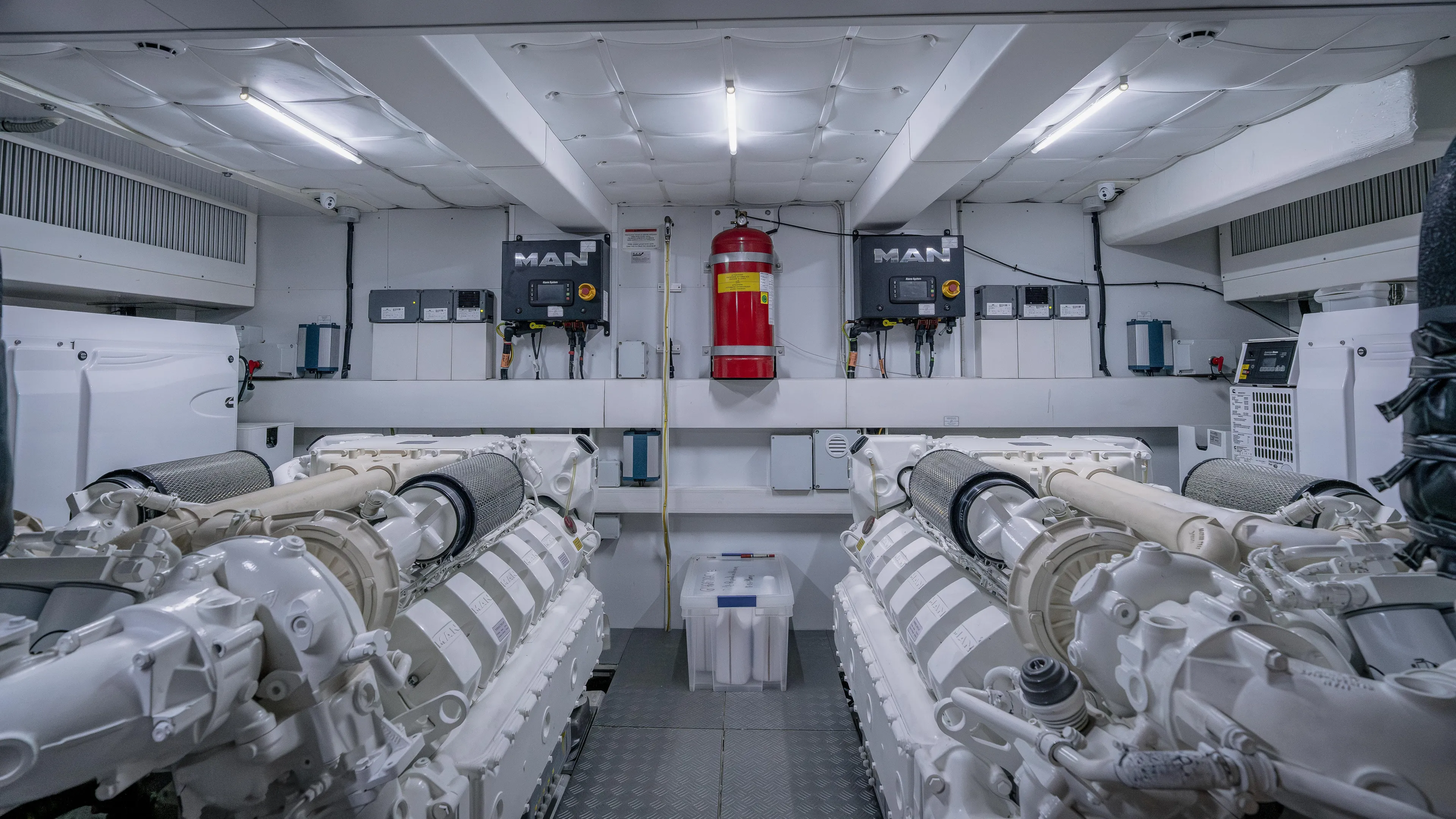  Yacht Photos Pics Engine room of 2022 Ferretti Yachts 720, featuring dual MAN engines and fire safety equipment.