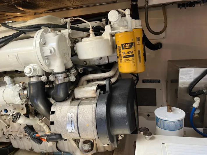  Yacht Photos Pics Engine compartment of a 2004 Cabo 35 Express with CAT fuel filter visible.