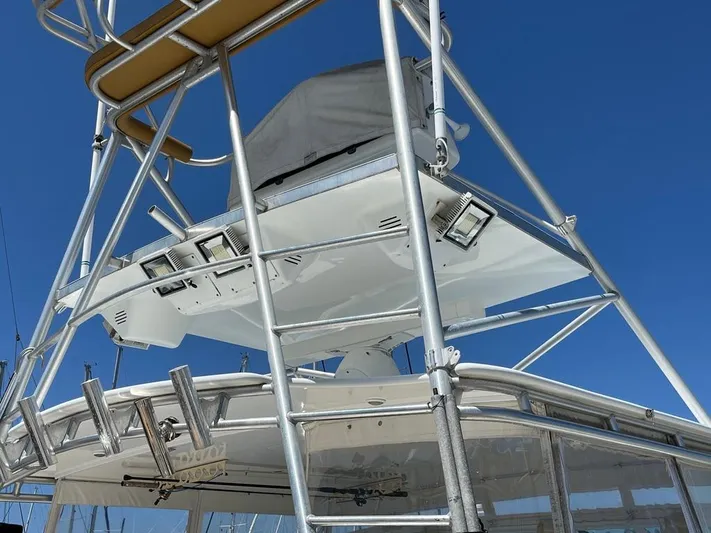  Yacht Photos Pics Tower structure of a 2004 Cabo 35 Express boat against a clear blue sky.