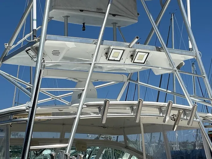  Yacht Photos Pics 2004 Cabo 35 Express boat tower with metal framework and mounted lights.