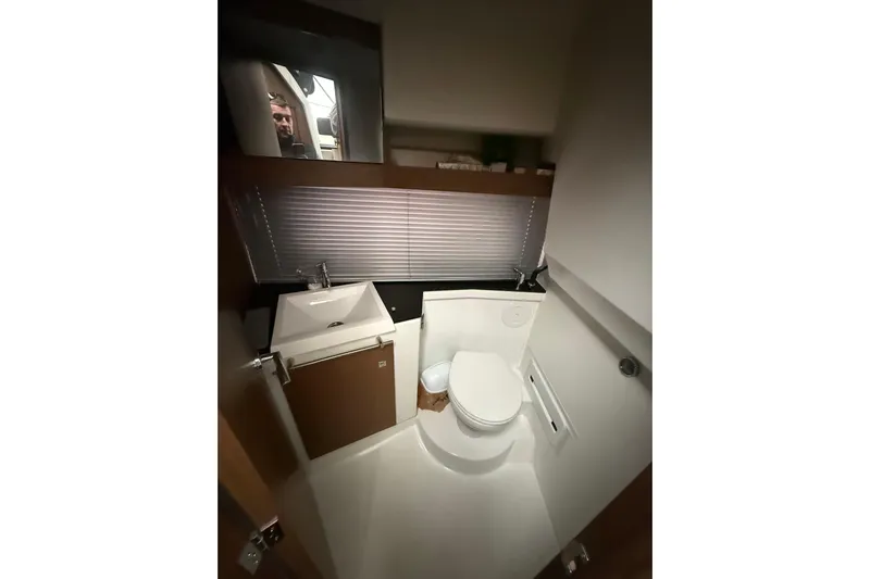  Yacht Photos Pics 2019 Jeanneau NC 9 boat bathroom with modern sink and toilet.