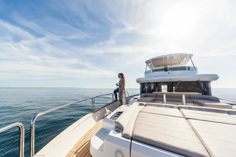 Salacia Yacht Photos Pics 2019 Sirena 64 yacht cruising on open sea under clear blue sky.