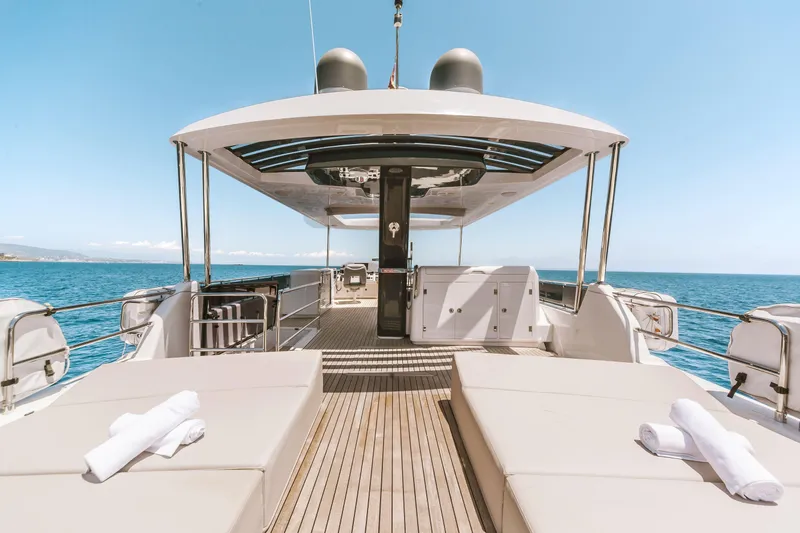Salacia Yacht Photos Pics Luxurious 2019 Sirena 64 yacht deck with sun loungers and ocean view.