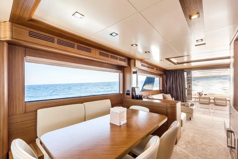 Salacia Yacht Photos Pics Luxurious interior of 2019 Sirena 64 yacht with ocean view and elegant furnishings.