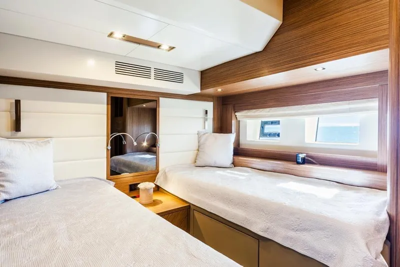 Salacia Yacht Photos Pics Luxurious cabin interior of 2019 Sirena 64 yacht with twin beds and modern decor.