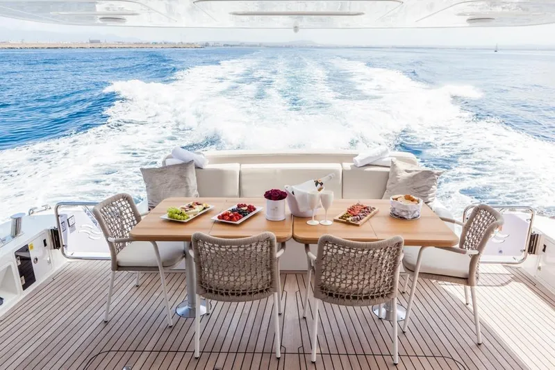 Salacia Yacht Photos Pics Luxurious dining setup on 2019 Sirena 64 yacht with ocean view.