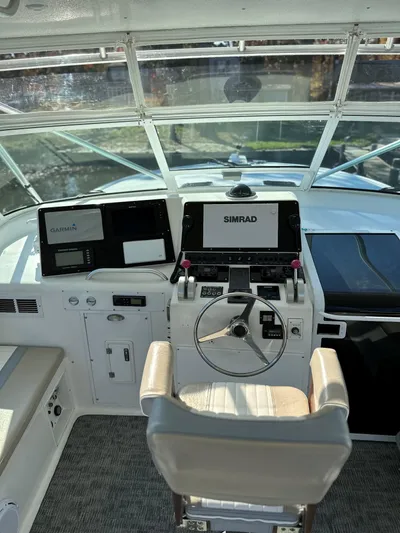 Bad Habit Yacht Photos Pics 1997 Viking 43 Open helm with Simrad navigation system and modern controls.
