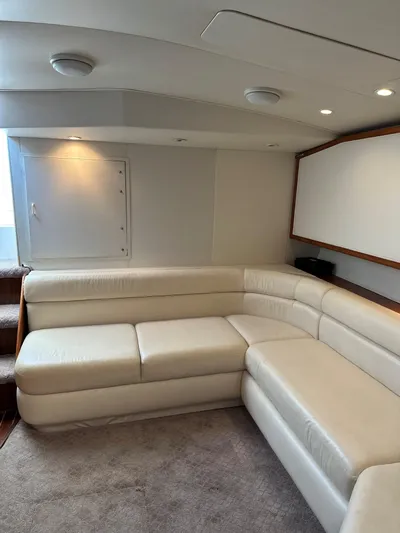 Bad Habit Yacht Photos Pics Luxurious interior of 1997 Viking 43 Open yacht with cream leather seating.