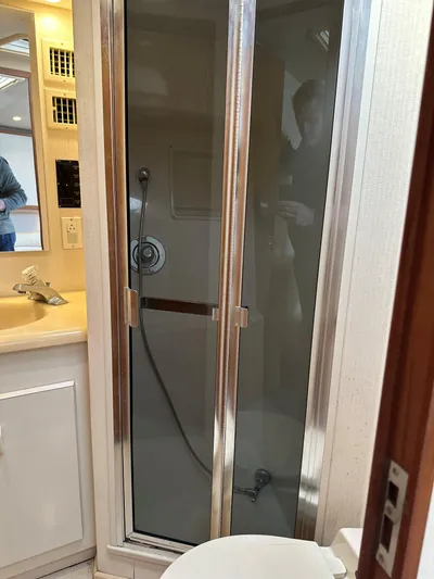 Bad Habit Yacht Photos Pics Bathroom interior of 1997 Viking 43 Open yacht with shower and sink.