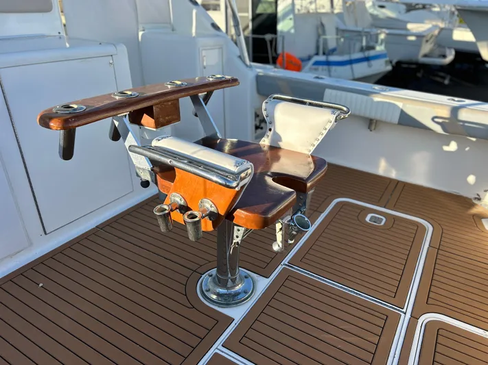 Bad Habit Yacht Photos Pics Fishing chair on 1997 Viking 43 Open yacht with teak deck.