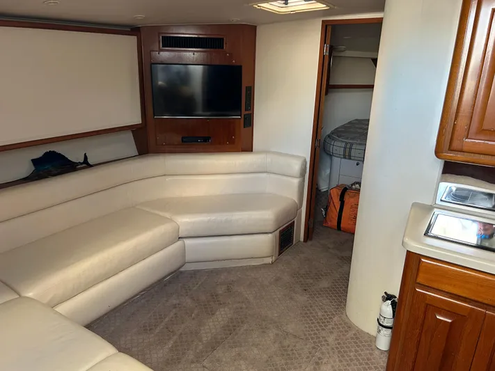 Bad Habit Yacht Photos Pics Luxurious interior of 1997 Viking 43 Open yacht with plush seating and modern amenities.