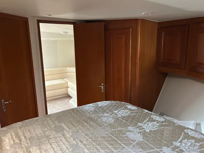 Bad Habit Yacht Photos Pics Interior of 1997 Viking 43 Open yacht with wood cabinetry and cozy seating area.