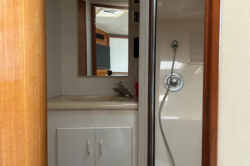 Bad Habit Yacht Photos Pics 1997 Viking 43 Open yacht bathroom with shower and sink.