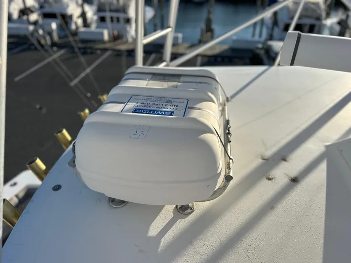 Bad Habit Yacht Photos Pics Viking 43 Open 1997 boat with mounted safety equipment on deck.