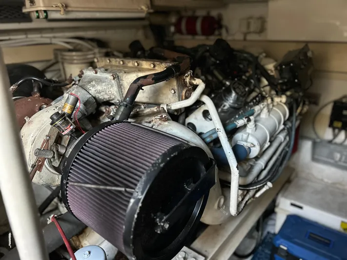 Bad Habit Yacht Photos Pics Engine room of a 1997 Viking 43 Open boat, showcasing detailed machinery components.