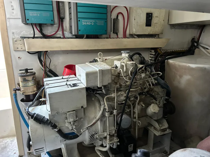 Bad Habit Yacht Photos Pics Engine room of a 1997 Viking 43 Open boat, featuring mechanical components and wiring.