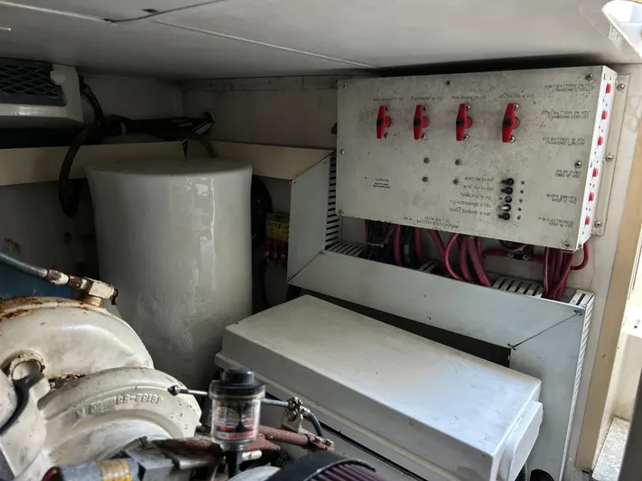 Bad Habit Yacht Photos Pics Engine room of 1997 Viking 43 Open boat with electrical panel and components.