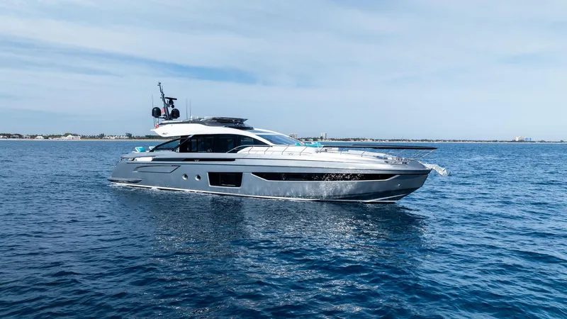 Ocean's Se7en Yacht Photos Pics 2022 Azimut S8 yacht cruising on open water under a clear sky.