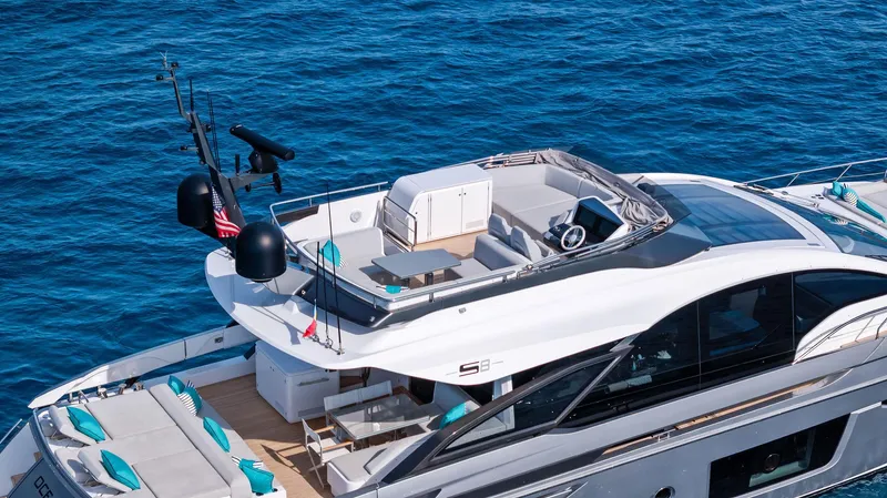 Ocean's Se7en Yacht Photos Pics Azimut S8 2022 luxury yacht on blue ocean water, featuring sleek design and spacious deck.