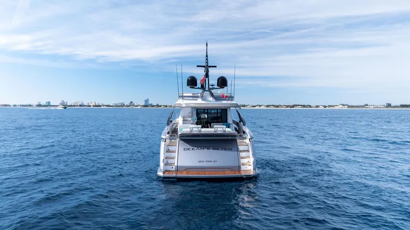 Ocean's Se7en Yacht Photos Pics Azimut S8 2022 luxury yacht on open sea, rear view with clear sky.