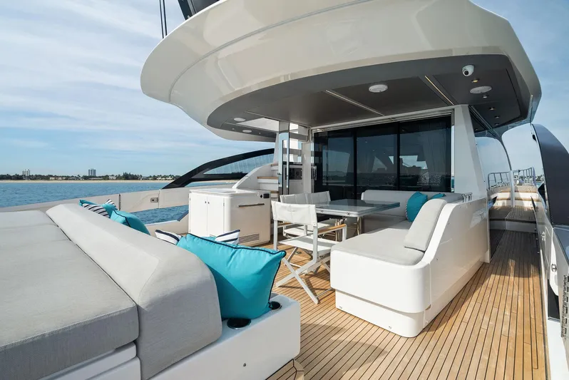Ocean's Se7en Yacht Photos Pics Luxury deck of 2022 Azimut S8 yacht with modern seating and ocean view.