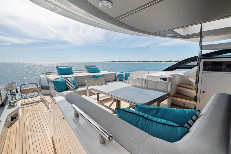 Ocean's Se7en Yacht Photos Pics Luxurious 2022 Azimut S8 yacht deck with elegant seating and ocean view.