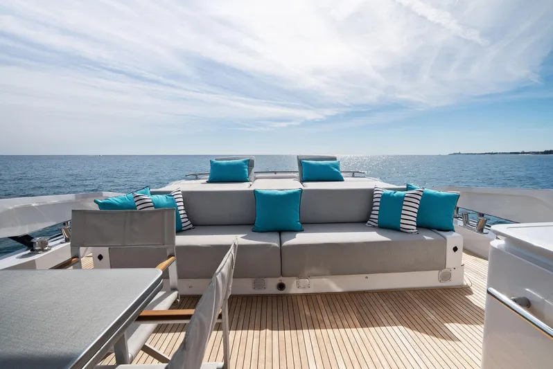Ocean's Se7en Yacht Photos Pics Luxury Azimut S8 yacht deck with stylish seating, ocean view, and blue cushions, 2022 model.