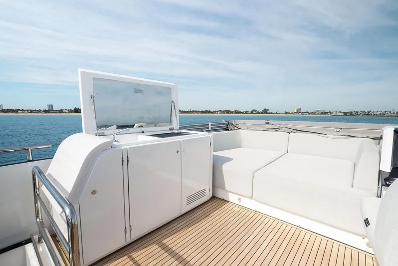 Ocean's Se7en Yacht Photos Pics 2022 Azimut S8 yacht deck with white seating and ocean view.