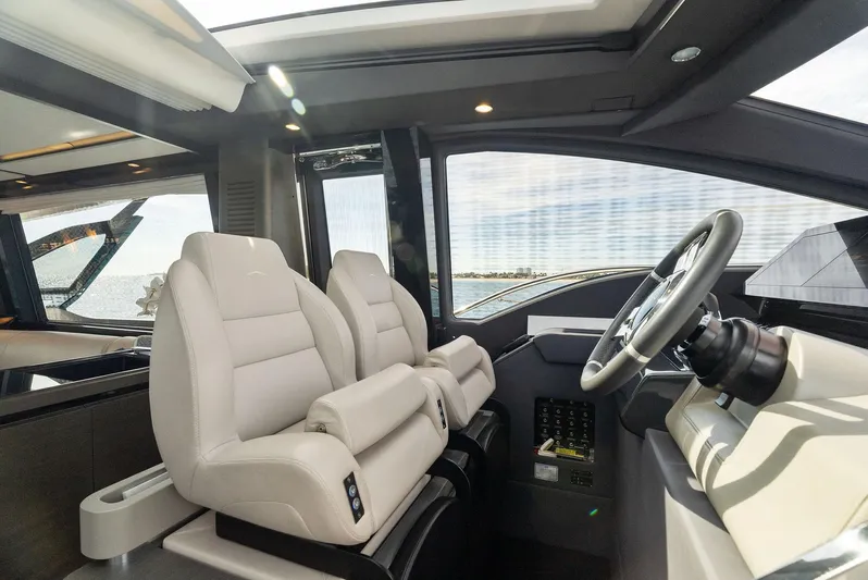 Ocean's Se7en Yacht Photos Pics Interior of 2022 Azimut S8 yacht with luxurious seating and modern helm.