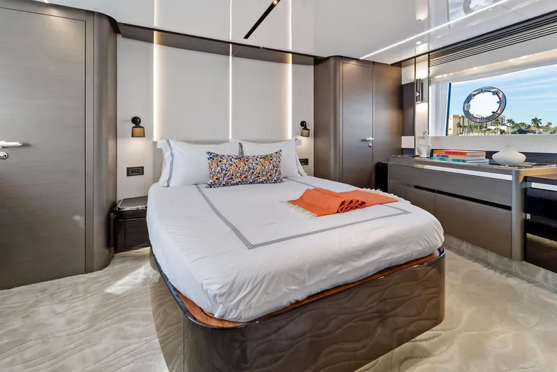 Ocean's Se7en Yacht Photos Pics Luxurious bedroom interior of 2022 Azimut S8 yacht with modern design and elegant furnishings.