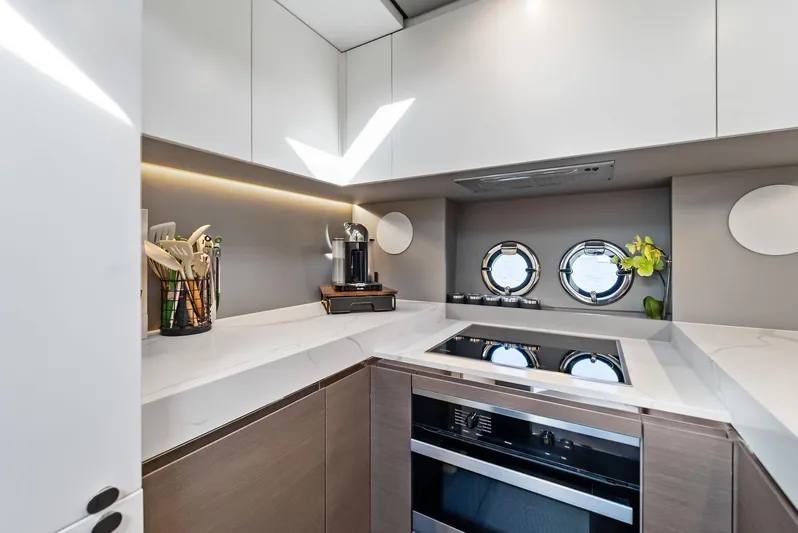 Ocean's Se7en Yacht Photos Pics Modern kitchen in 2022 Azimut S8 yacht with sleek design and appliances.
