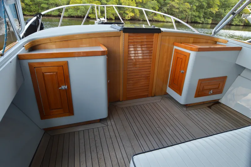  Yacht Photos Pics 2023 Strike 29 boat interior with wooden cabinets and sleek design.