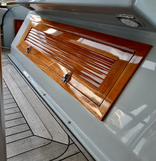  Yacht Photos Pics 2023 Strike 29 boat interior with polished wood panel and sleek design.