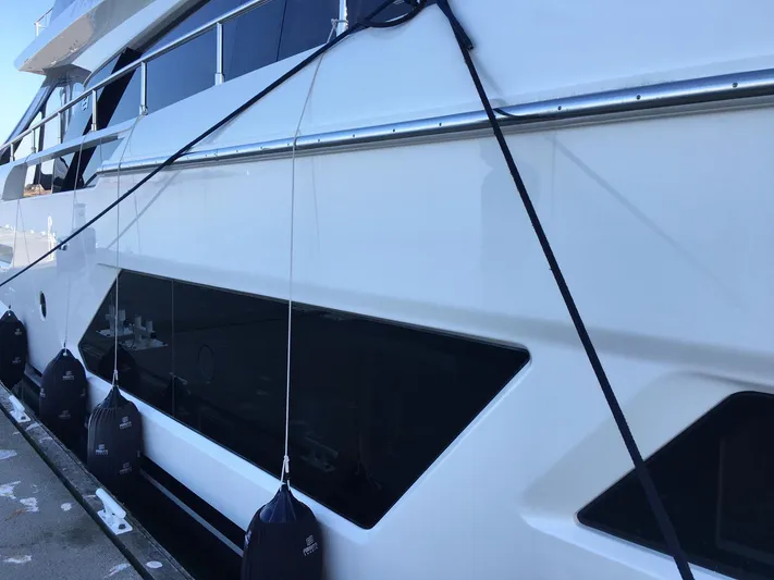  Yacht Photos Pics 2018 Ferretti Yachts 670 docked, showcasing sleek design and modern features.