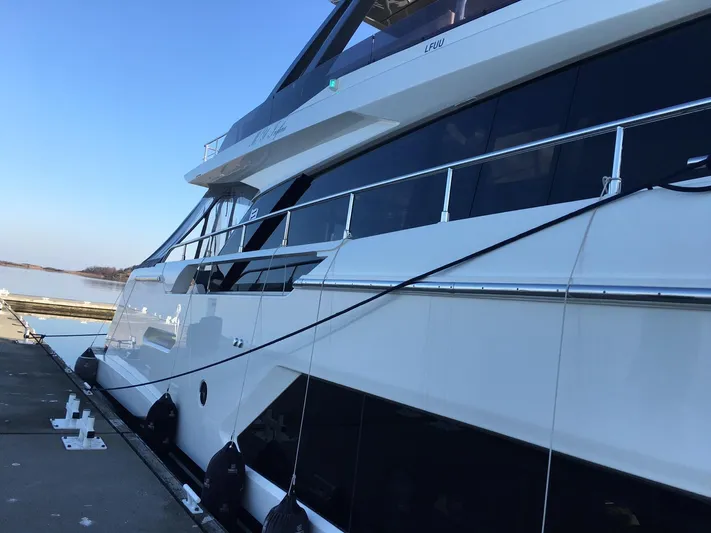  Yacht Photos Pics Luxury Ferretti Yachts 670, 2018 model, docked at a marina under clear blue skies.