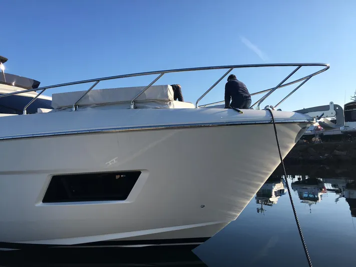 Yacht Photos Pics 2018 Ferretti Yachts 670 docked, showcasing sleek design and modern features.