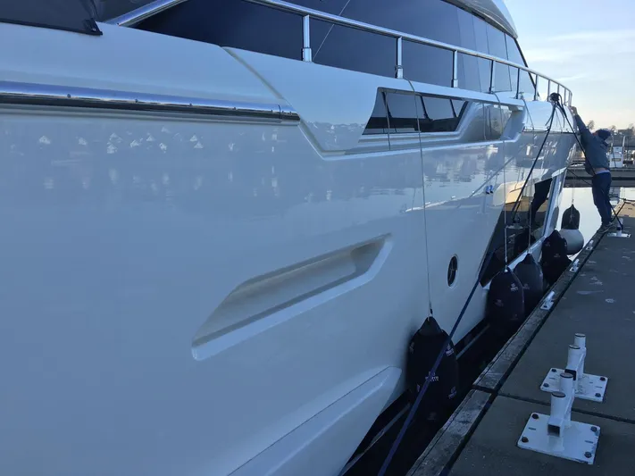 Yacht Photos Pics 2018 Ferretti Yachts 670 docked, showcasing sleek design and modern features.