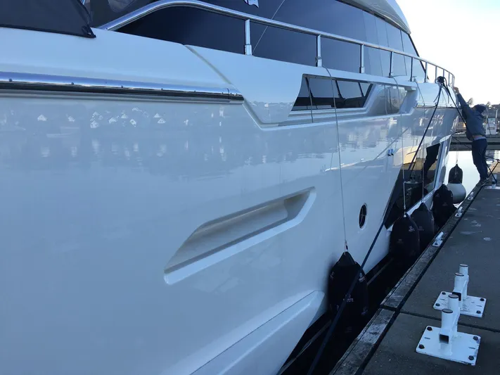  Yacht Photos Pics 2018 Ferretti Yachts 670 docked, showcasing sleek white exterior and modern design.