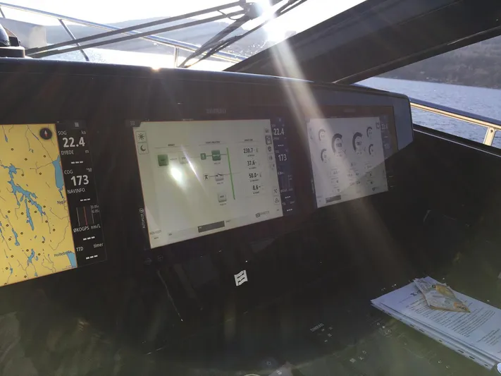  Yacht Photos Pics Helm dashboard of 2018 Ferretti Yachts 670 with navigation and control screens.