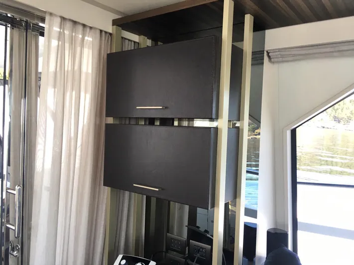  Yacht Photos Pics Luxurious interior of 2018 Ferretti Yachts 670, featuring sleek cabinetry and modern design elements.