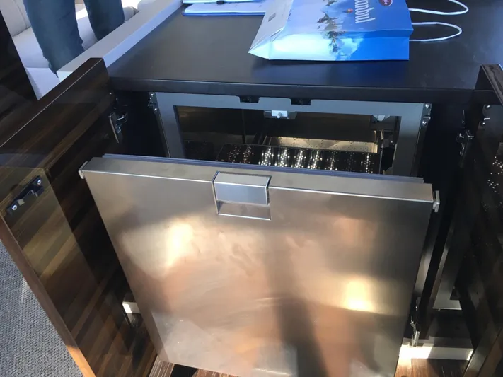  Yacht Photos Pics Stainless steel appliance on 2018 Ferretti Yachts 670, open cabinet view.