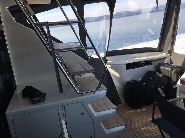  Yacht Photos Pics Interior view of 2018 Ferretti Yachts 670, featuring sleek design and ocean backdrop.